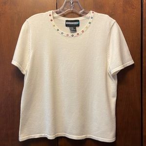 Requirements off-white knit tee with rainbow grommets